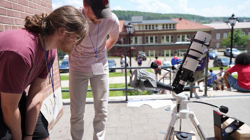 campers looking through our high powered telescope